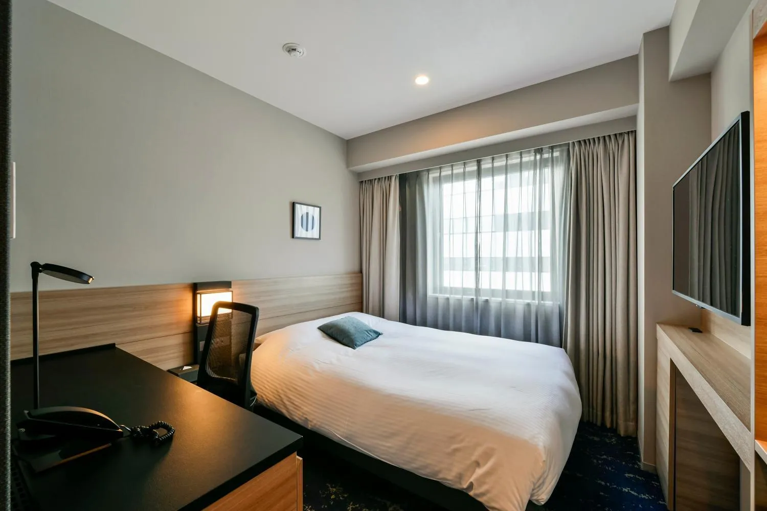 Bed in Hotel JAL City Miyazaki