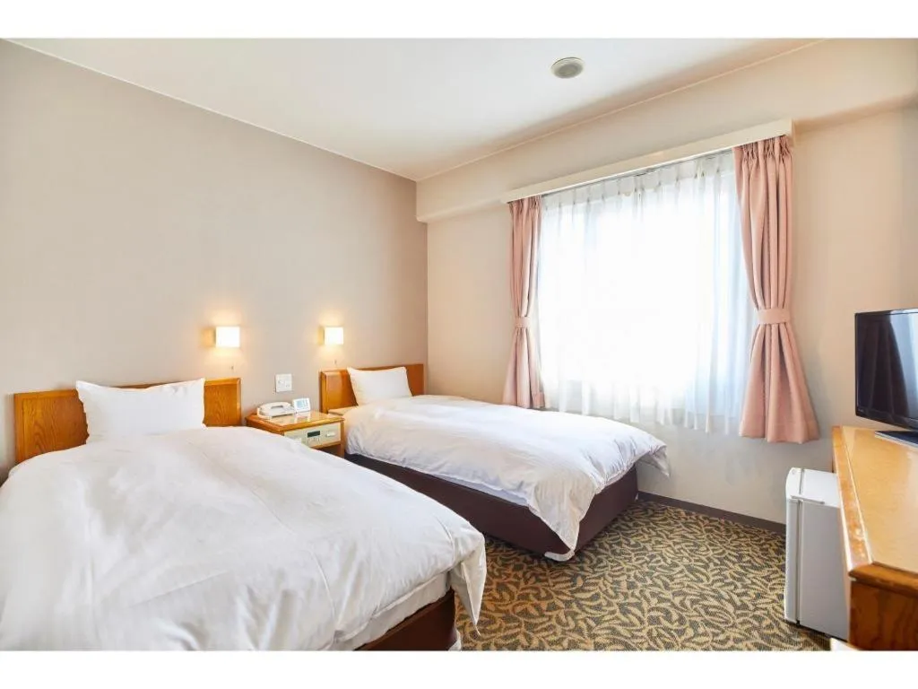 Bed in Inuyama Central Hotel