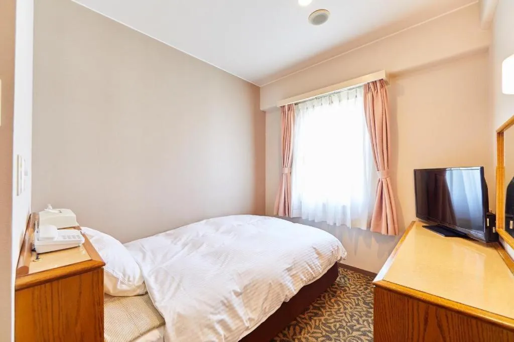 Bed in Inuyama Central Hotel