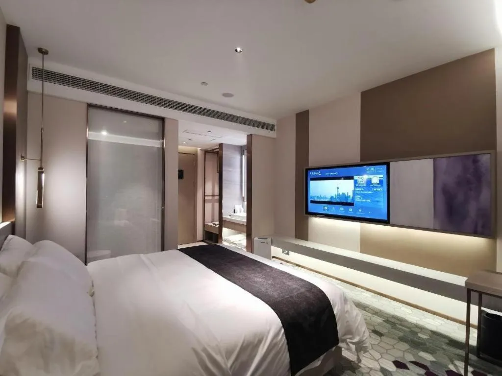 Bed in Lavande Hotel Shanghai Jing'an Shibei Gaoxin
