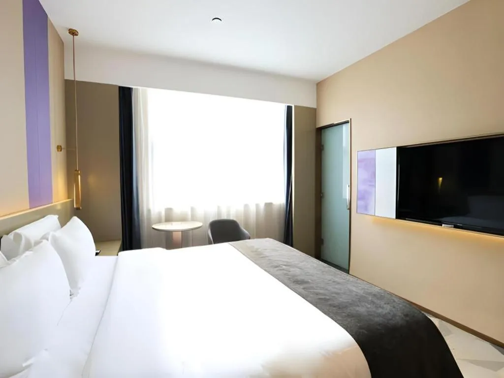 Bed in Lavande Hotel Zhongshan Shiqi Daxinxinduhui North Zhongshan Station