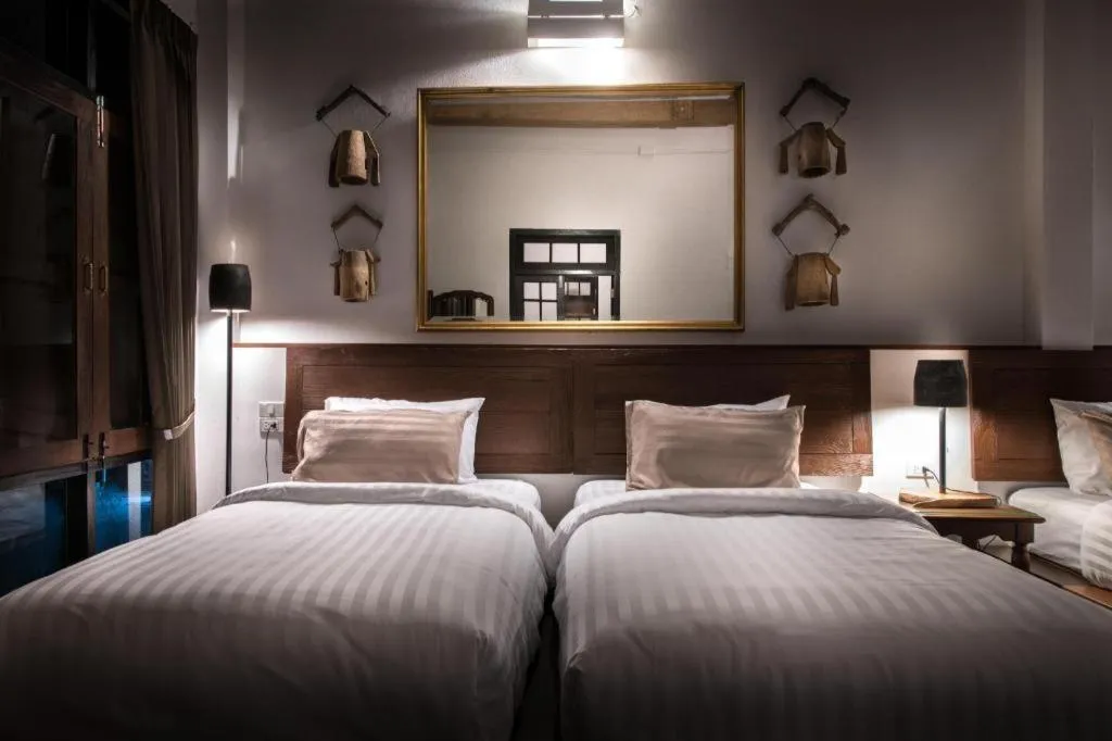 Bed in Uthai Heritage Hotel