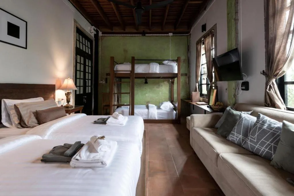 Bed in Uthai Heritage Hotel