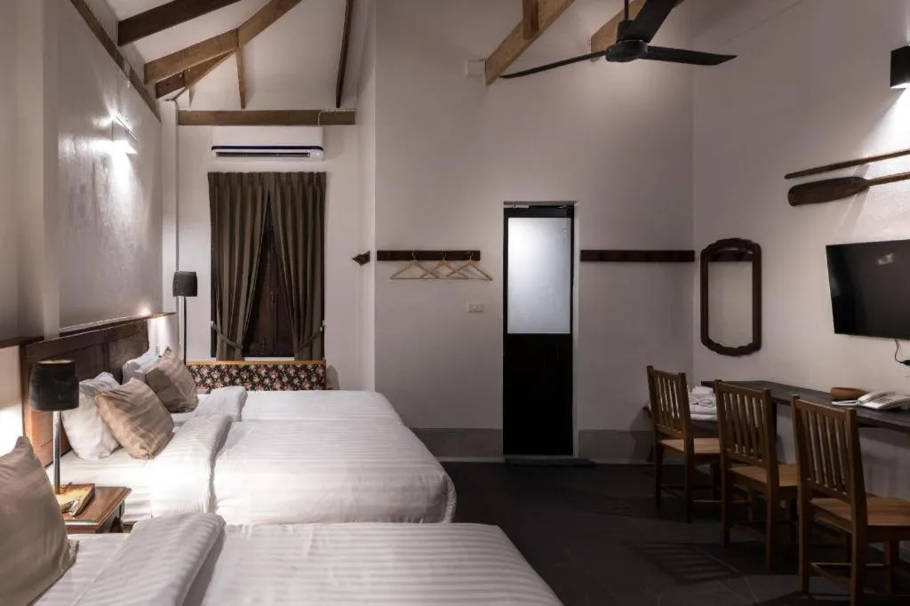 Bed in Uthai Heritage Hotel