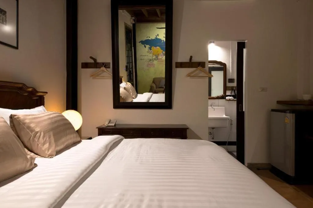 Bed in Uthai Heritage Hotel