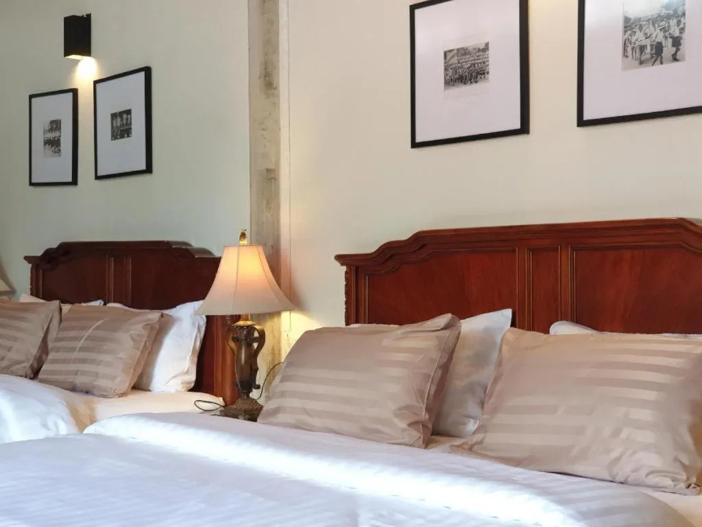 Bed in Uthai Heritage Hotel