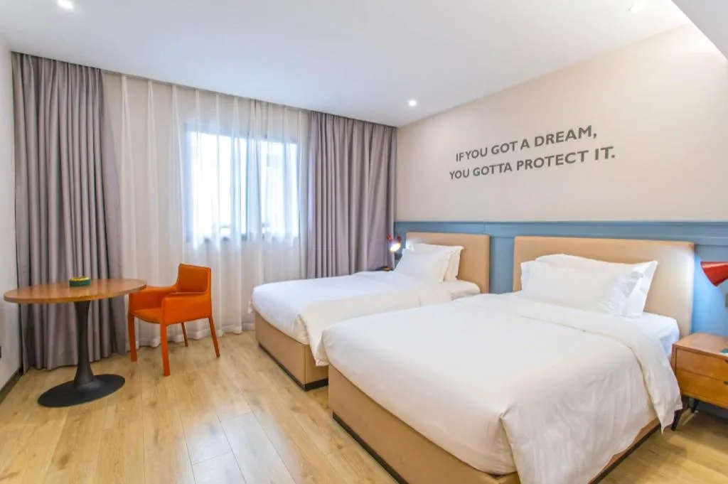 Bed in Premier City Comfort Hotel Yangzhou Shouxi Lake West Gate Weiyang Road Siji Garden