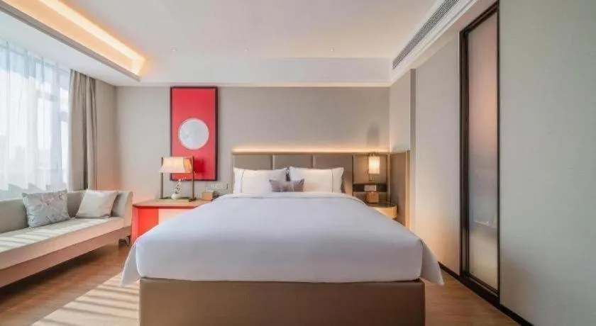 Bed in Echeng Hotel Hezhou Shizheng Square