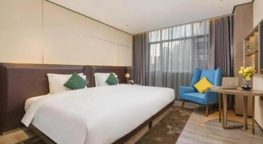 Bed in Echarm Plus Hotel Hangzhou Binjiang Xingguang Avenue
