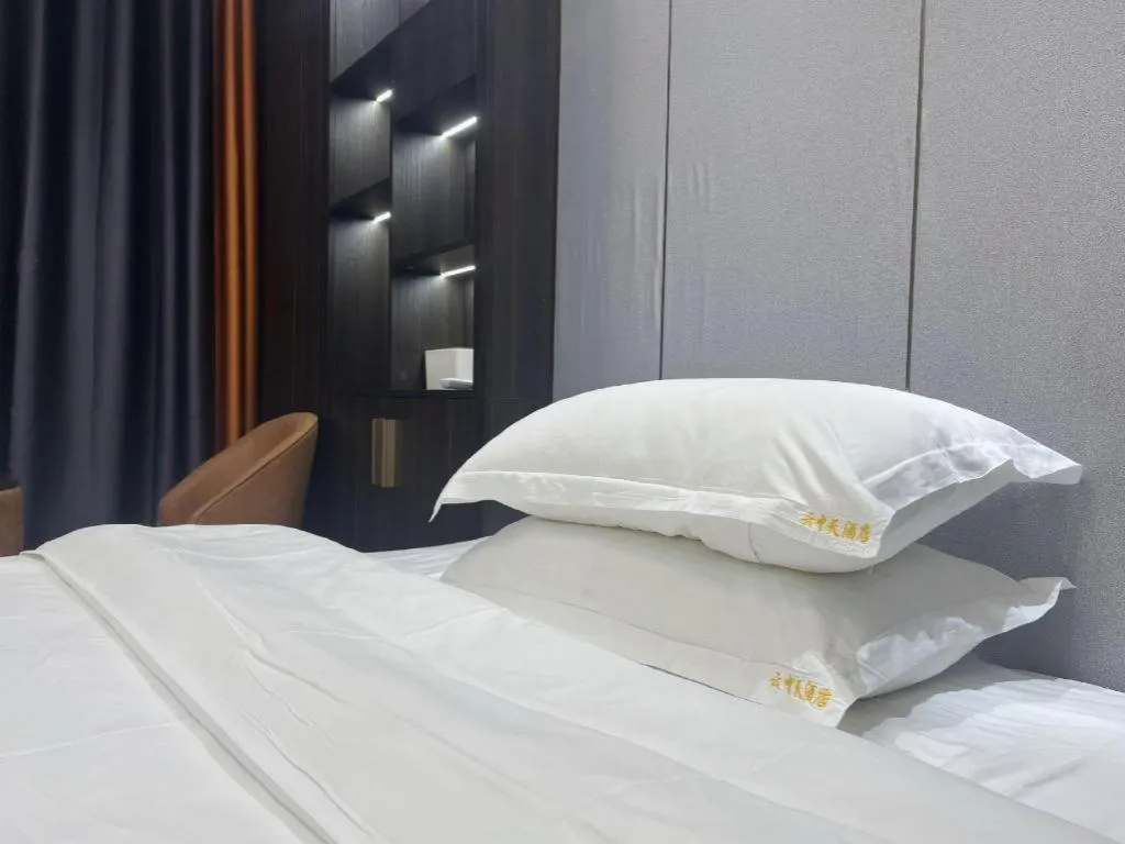 Bed in Echarm Hotel Changsha South High-Speed Railway Station Wuyue Plaza