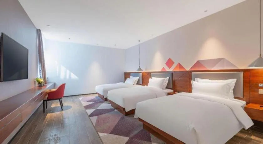 Bed in Borrman Hotel Guilin North Railway Station Zhonghao International