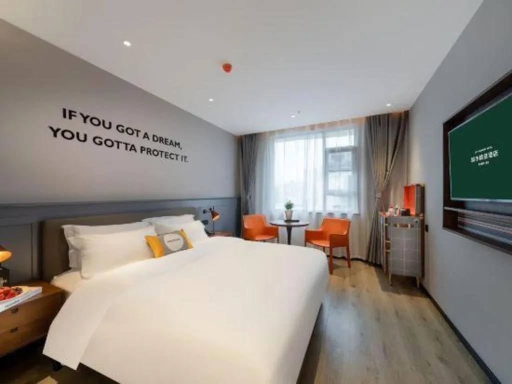 Bed in Premier City Comfort Hotel Suizhou Wuyue Plaza