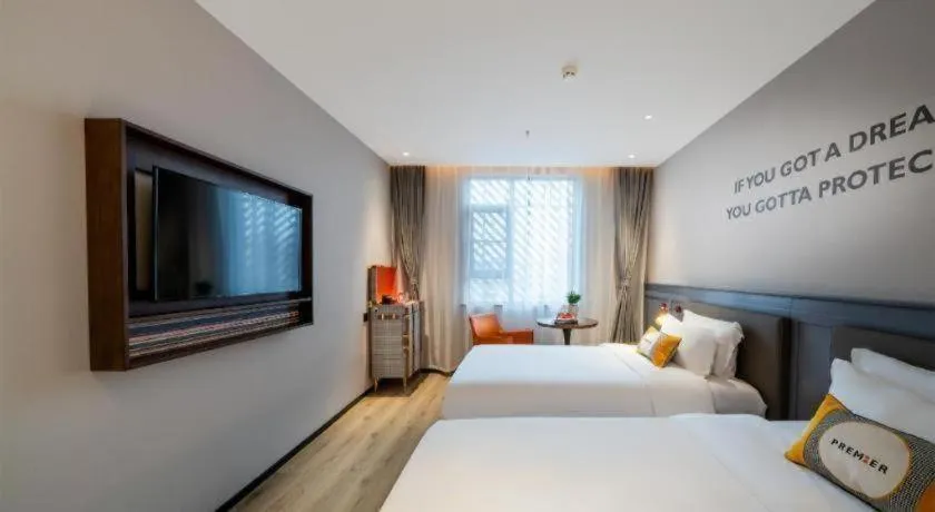 Bed in Premier City Comfort Hotel Suizhou Wuyue Plaza