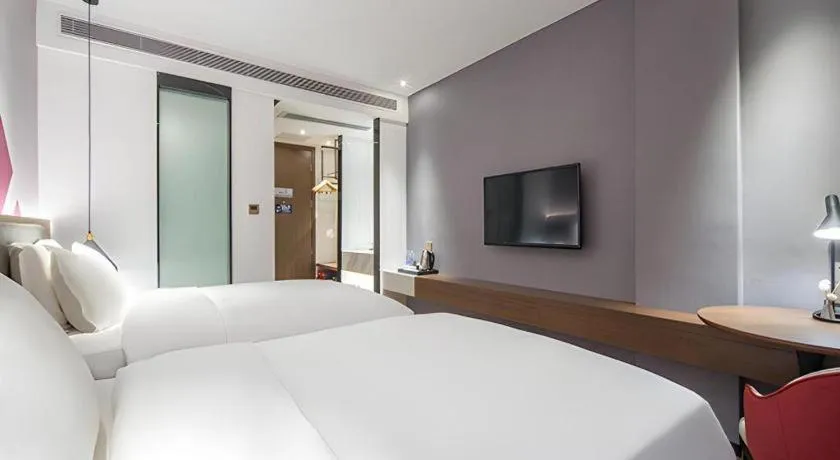 Bed in Borrman Hotel Wuzhou Teng County