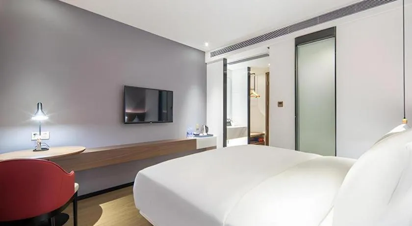 Bed in Borrman Hotel Wuzhou Teng County