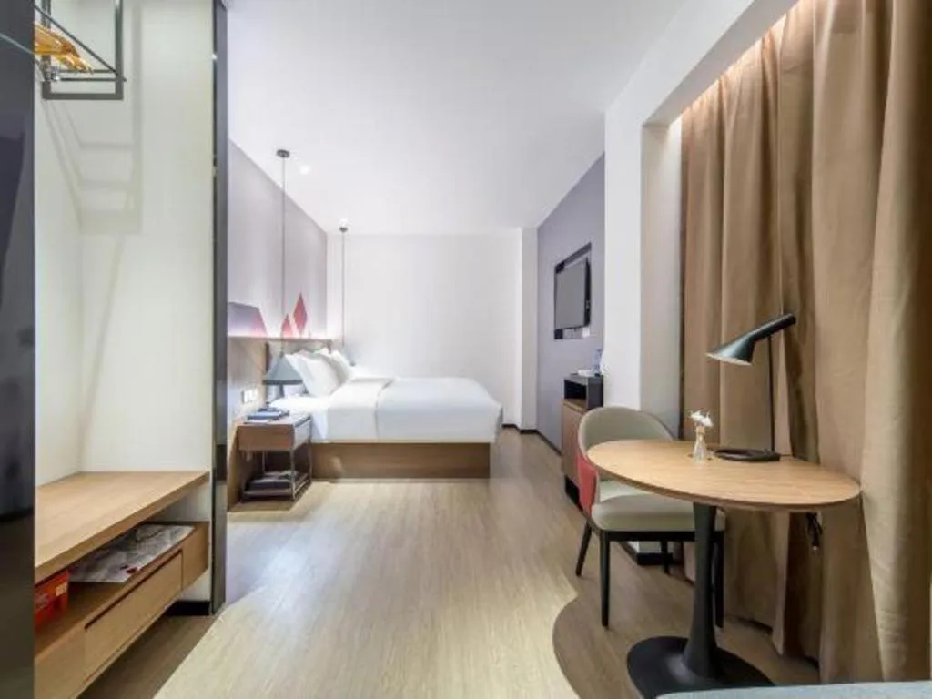 Bed in Borrman Hotel Wuzhou Teng County