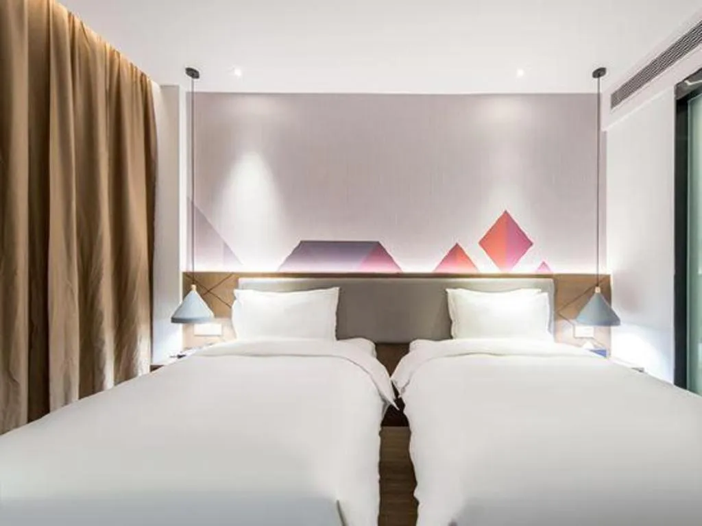 Bed in Borrman Hotel Wuzhou Teng County