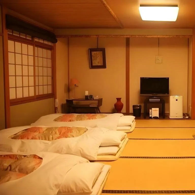 Bed in Hotel Miyoshino Annex