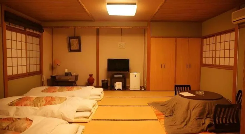 Bed in Hotel Miyoshino Annex