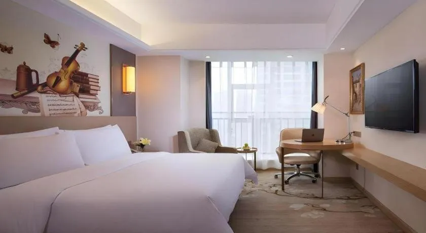 Bed in Vienna Hotel Zhengzhou East High-Speed Railway Station