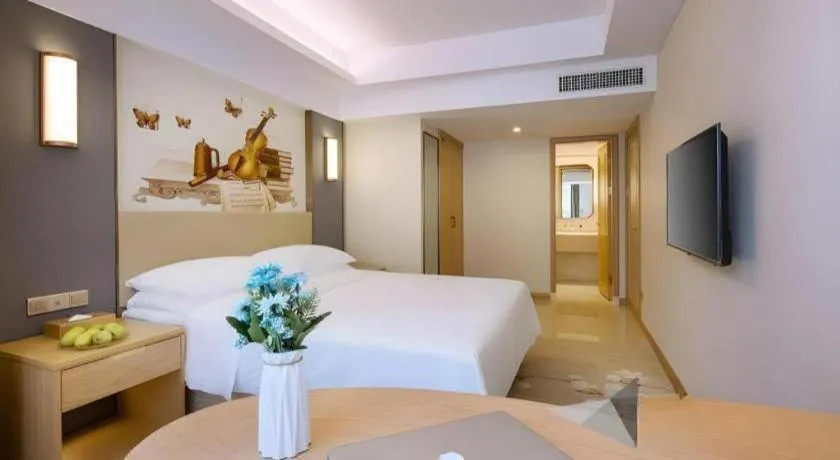 Bed in Vienna Hotel Zhengzhou East High-Speed Railway Station