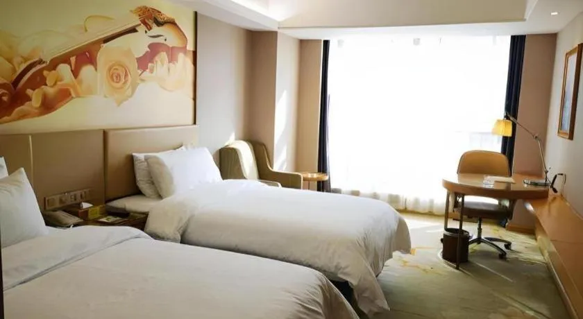 Bed in Vienna Hotel Zhengzhou East High-Speed Railway Station