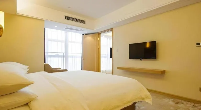 Bed in Vienna Hotel Zhengzhou East High-Speed Railway Station