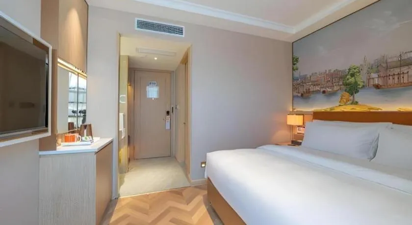 Bed in Vienna Hotel Chongqing West Station Square