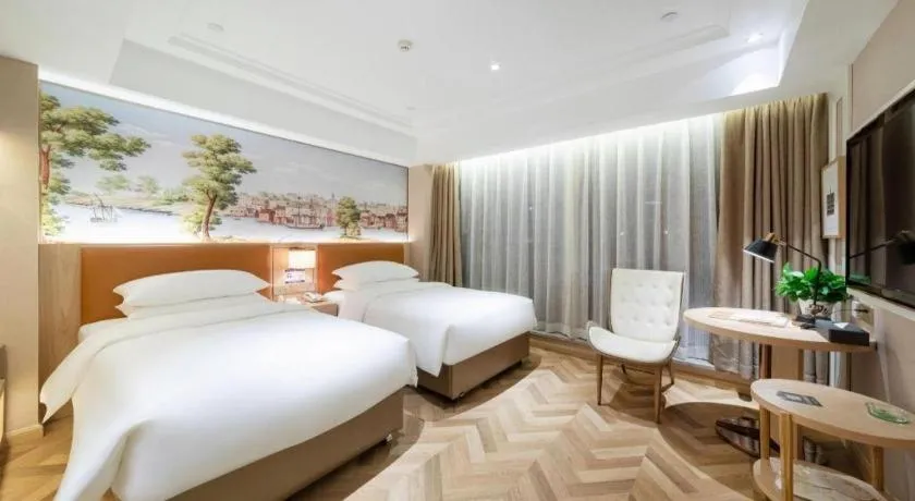 Bed in Vienna Hotel Chongqing West Station Square