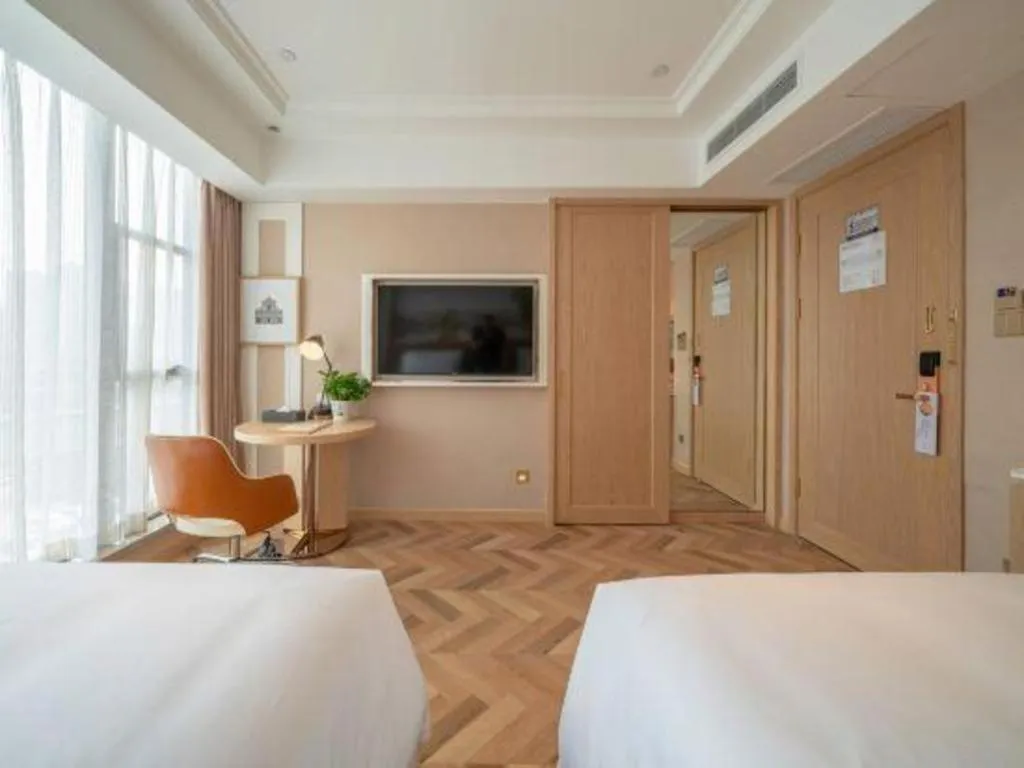 Bed in Vienna Hotel Chongqing West Station Square