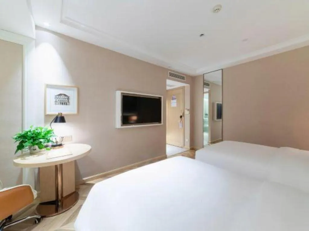 Bed in Vienna Hotel Chongqing West Station Square