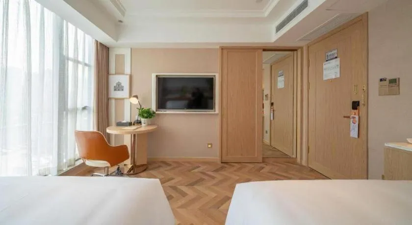 Bed in Vienna Hotel Chongqing West Station Square