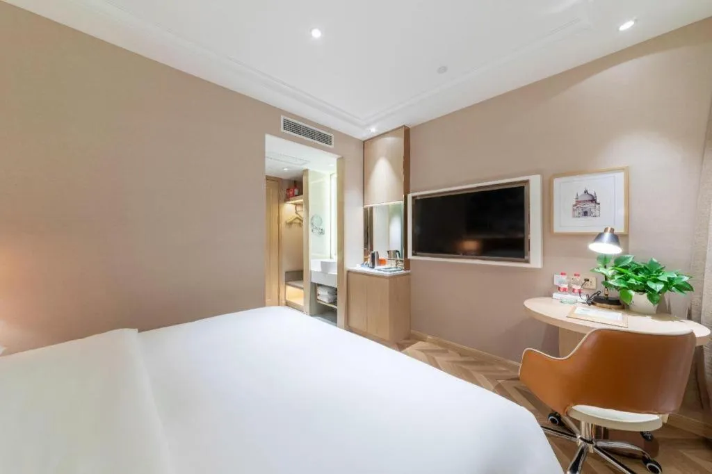 Bed in Vienna Hotel Chongqing West Station Square