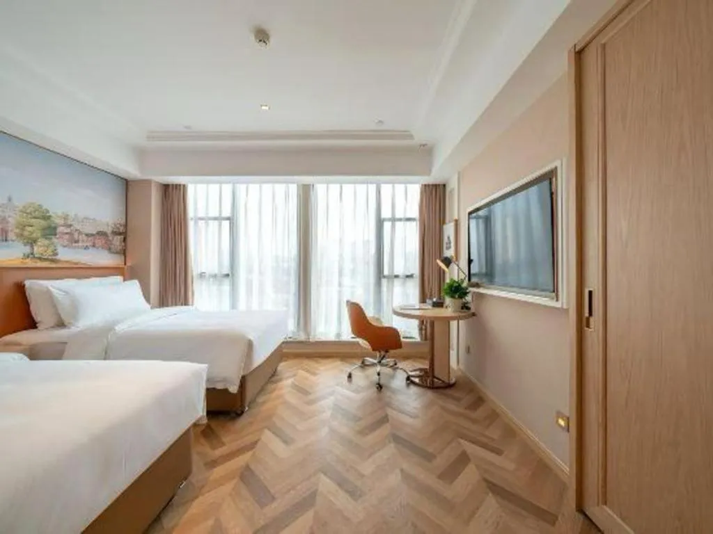 Bed in Vienna Hotel Chongqing West Station Square