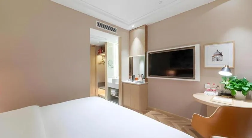 Bed in Vienna Hotel Chongqing West Station Square