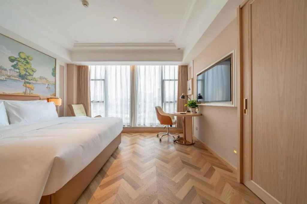 Bed in Vienna Hotel Chongqing West Station Square