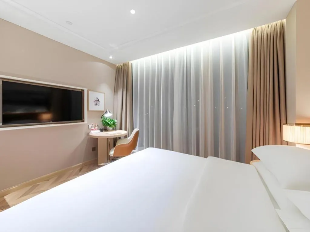 Bed in Vienna Hotel Chongqing West Station Square