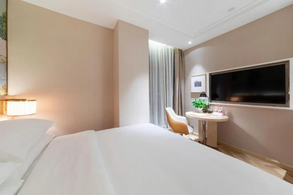 Bed in Vienna Hotel Chongqing West Station Square