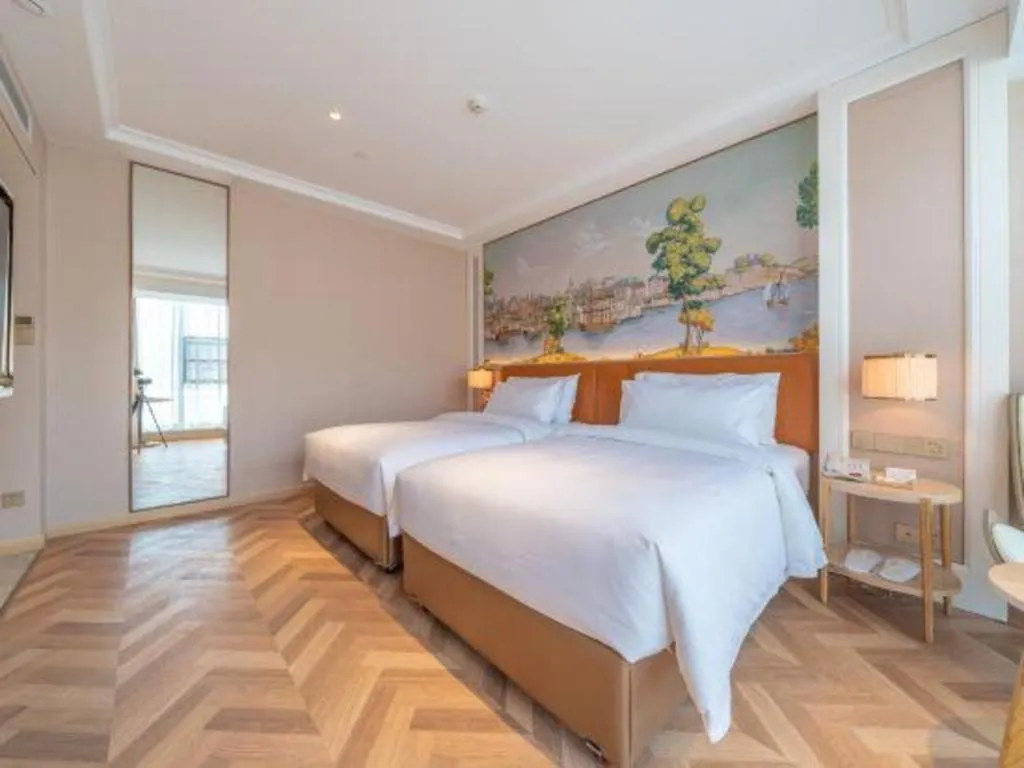 Bed in Vienna Hotel Chongqing West Station Square