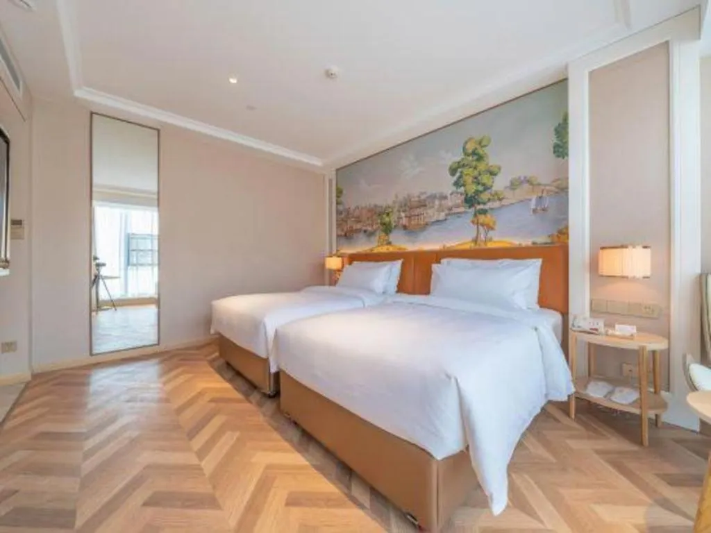 Bed in Vienna Hotel Chongqing West Station Square