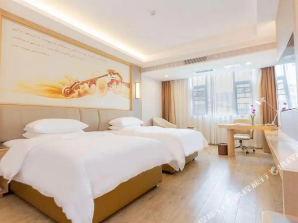 Bed in Vienna Hotel Yuxi Hongta Avenue High-Speed Railway Station