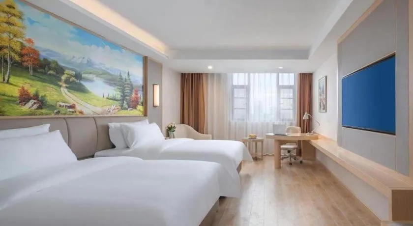 Bed in Vienna Hotel Yuxi Hongta Avenue High-Speed Railway Station