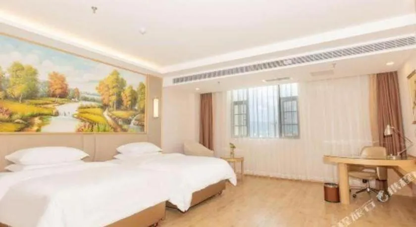 Bed in Vienna Hotel Yuxi Hongta Avenue High-Speed Railway Station