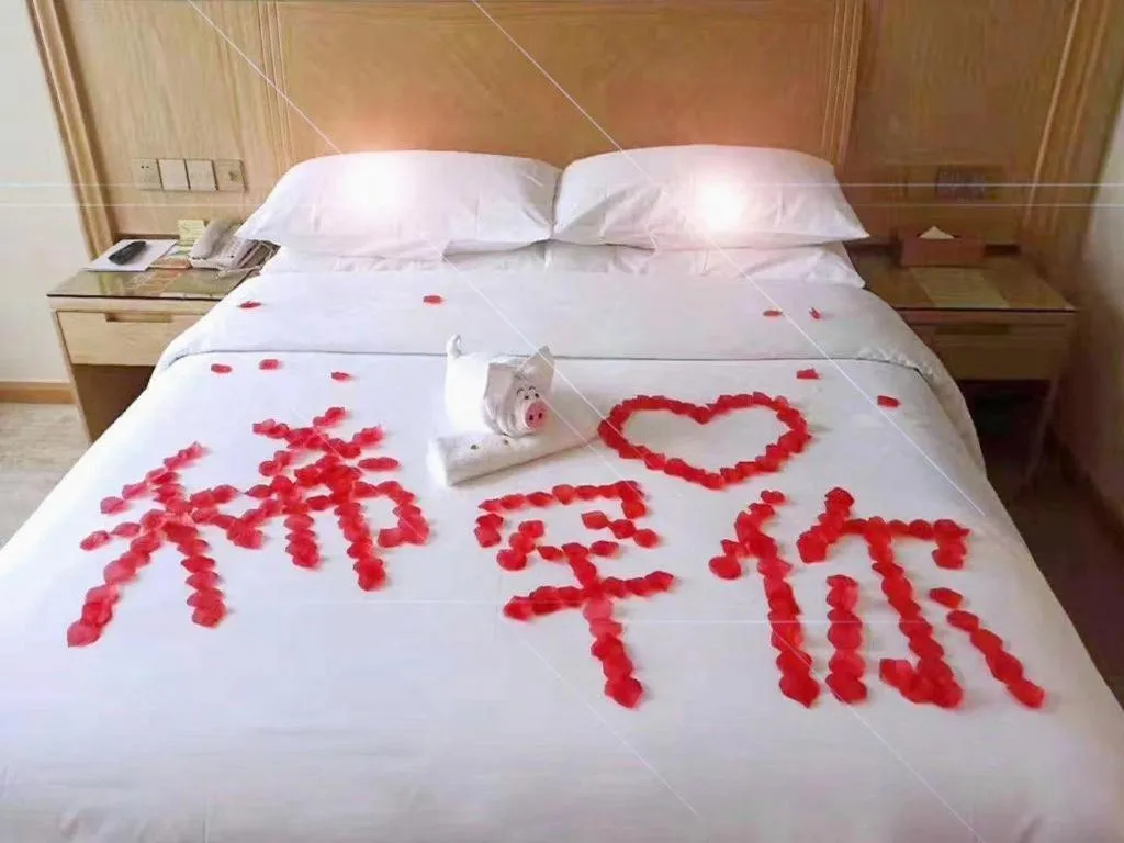 Bed in Vienna Hotel Chongqing Shizhu Stadium