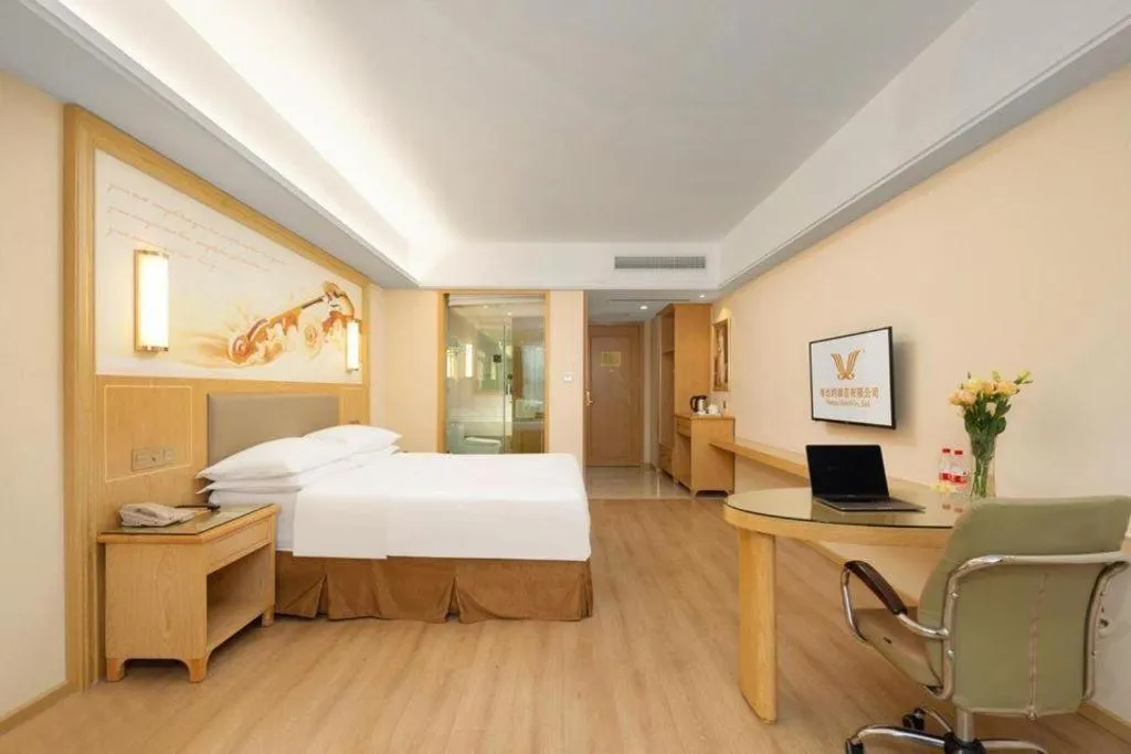 Bed in Vienna Hotel Chongqing Shizhu Stadium