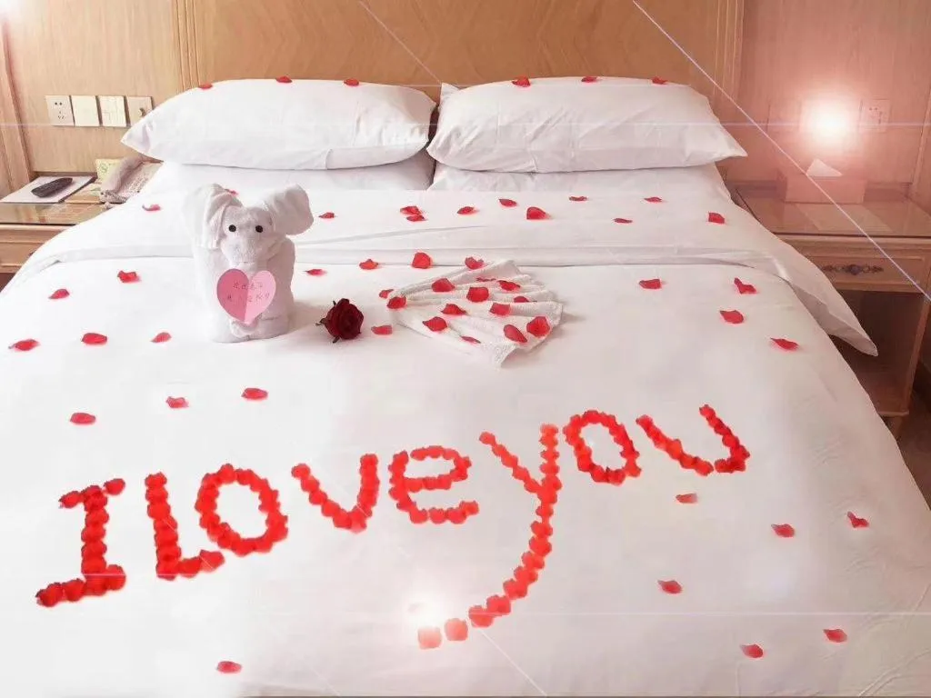 Bed in Vienna Hotel Chongqing Shizhu Stadium