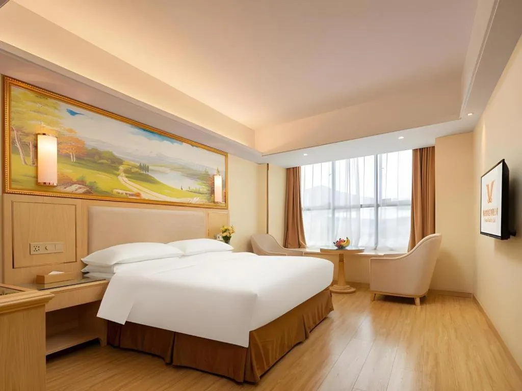 Bed in Vienna Hotel Chongqing Shizhu Stadium
