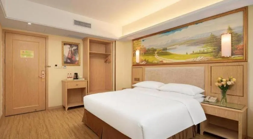 Bed in Vienna Hotel Chongqing Shizhu Stadium