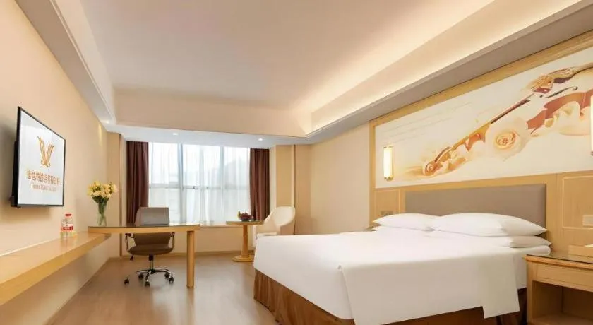 Bed in Vienna Hotel Chongqing Shizhu Stadium