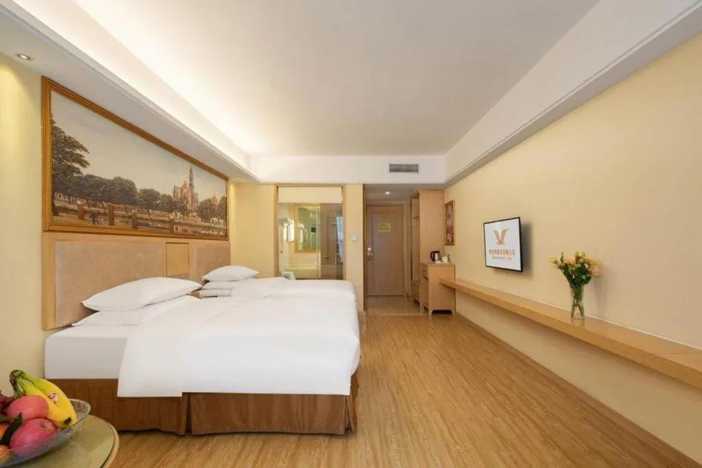 Bed in Vienna Hotel Chongqing Shizhu Stadium